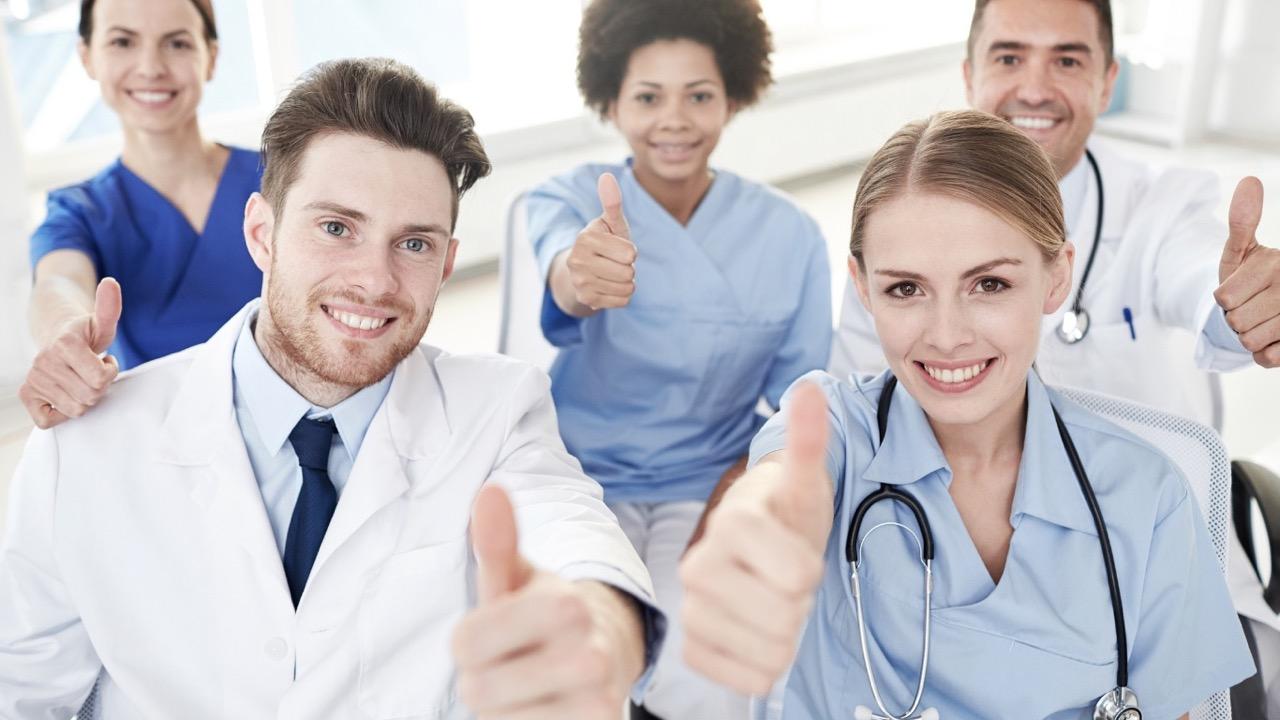 group of doctor signing thumbs up
